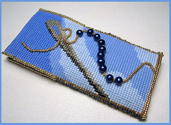 Side one of blue needle case