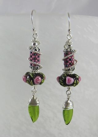 lampwork and seeds with a glass leaf dangle